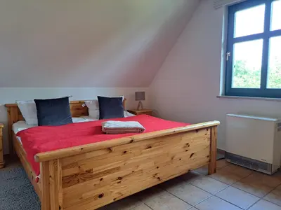 Ein Bett oder Betten in einem Zimmer der Unterkunft Am Deich Strandhaus OG
