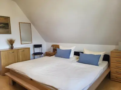 Ein Bett oder Betten in einem Zimmer der Unterkunft Abels Strandkoje