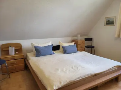 Ein Bett oder Betten in einem Zimmer der Unterkunft Abels Strandkoje
