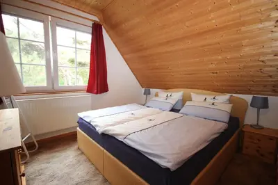 Ein Bett oder Betten in einem Zimmer der Unterkunft Am Strand