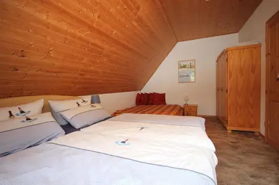 Ein Bett oder Betten in einem Zimmer der Unterkunft Am Strand