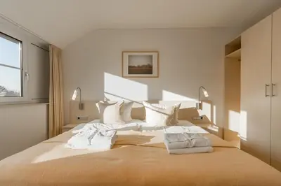 Ein Bett oder Betten in einem Zimmer der Unterkunft 2 Raum Ferienwohnung Ostseeperle Superior