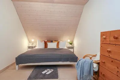 Ein Bett oder Betten in einem Zimmer der Unterkunft Haus Nastassja App 04