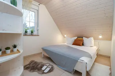 Ein Bett oder Betten in einem Zimmer der Unterkunft Haus Nastassja App 04