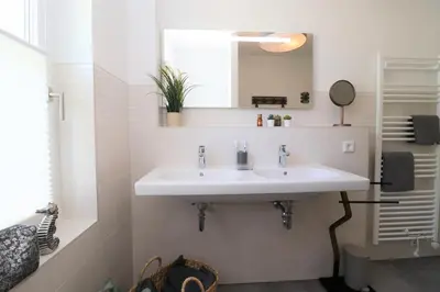 Ein Badezimmer in der Unterkunft Sonnenseite App 09