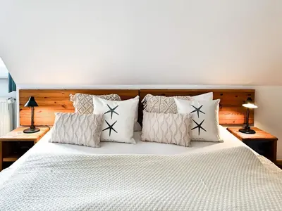 Ein Bett oder Betten in einem Zimmer der Unterkunft Residenz Kormoran, Ankerzeit