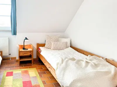 Ein Bett oder Betten in einem Zimmer der Unterkunft Residenz Kormoran, Ankerzeit
