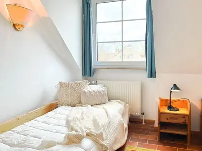Ein Bett oder Betten in einem Zimmer der Unterkunft Residenz Kormoran, Ankerzeit