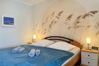 Ein Bett oder Betten in einem Zimmer der Unterkunft In den Wiesen App 2