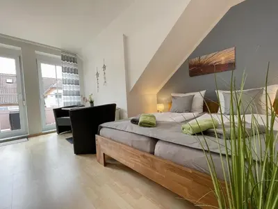 Ein Bett oder Betten in einem Zimmer der Unterkunft Ferienwohnung Kleine Brise