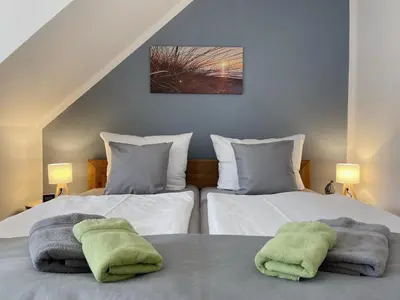 Ein Bett oder Betten in einem Zimmer der Unterkunft Ferienwohnung Kleine Brise