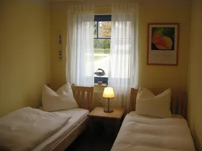 Ein Bett oder Betten in einem Zimmer der Unterkunft Ferienwohnung Graureiher in Prerow