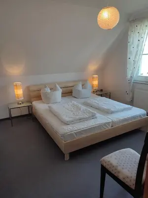 Ein Bett oder Betten in einem Zimmer der Unterkunft Martha-Müller-Grählert-Weg 7 8 Wg 8