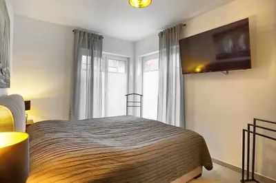 Ein Bett oder Betten in einem Zimmer der Unterkunft Haus Seevogel - Suite Kormoran PP 16