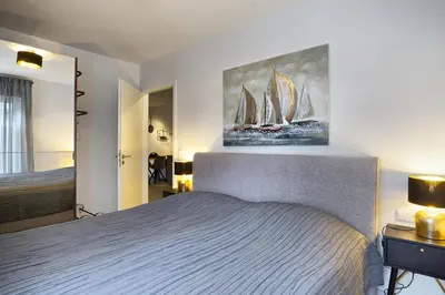 Ein Bett oder Betten in einem Zimmer der Unterkunft Haus Seevogel - Suite Kormoran PP 16