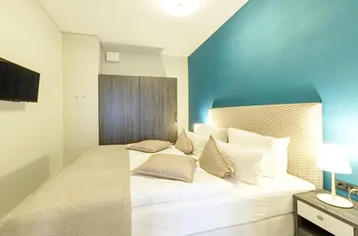 Ein Bett oder Betten in einem Zimmer der Unterkunft Ferienwohnung Ostseeblick mit Balkon