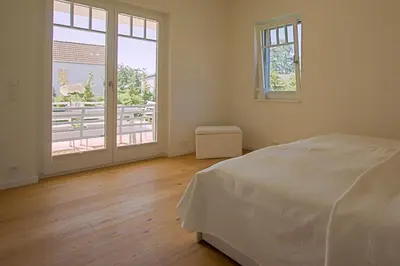 Ein Bett oder Betten in einem Zimmer der Unterkunft Haus am Schilf