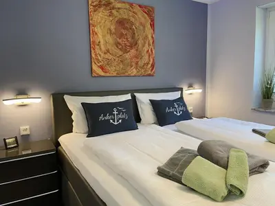 Ein Bett oder Betten in einem Zimmer der Unterkunft Ferienwohnung Ankerplatz - a85478
