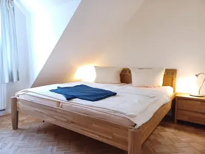 Ein Bett oder Betten in einem Zimmer der Unterkunft Strandhaus Jonathan 4 OG