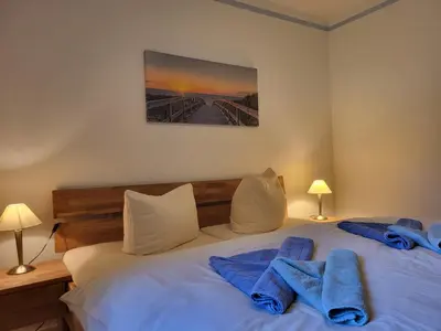 Ein Bett oder Betten in einem Zimmer der Unterkunft Strandhaus Jonathan 2 EG