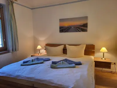 Ein Bett oder Betten in einem Zimmer der Unterkunft Strandhaus Jonathan 2 EG