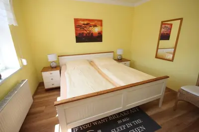 Ein Bett oder Betten in einem Zimmer der Unterkunft Ferienwohnung Leitzsch