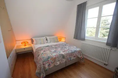 Ein Bett oder Betten in einem Zimmer der Unterkunft Strandhaus fuenfzehn