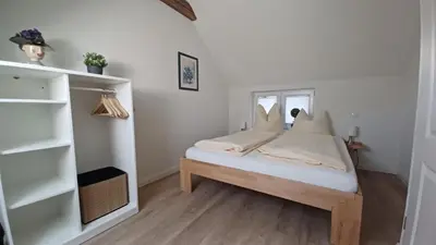 Ein Bett oder Betten in einem Zimmer der Unterkunft Haus 1795 Schwalbennest