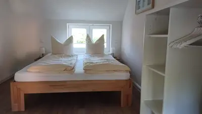 Ein Bett oder Betten in einem Zimmer der Unterkunft Haus 1795 Schwalbennest