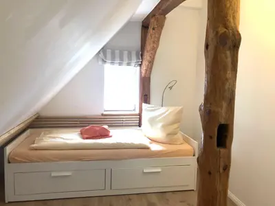 Ein Bett oder Betten in einem Zimmer der Unterkunft Ferienwohnung im Kapitänshaus