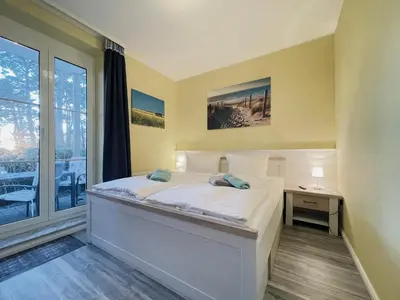 Ein Bett oder Betten in einem Zimmer der Unterkunft Ferienwohnung Stranddüne 117