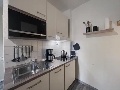 Küche/Küchenzeile in der Unterkunft Ferienwohnung Stranddüne 117