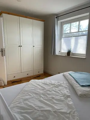 Ein Bett oder Betten in einem Zimmer der Unterkunft Haus 