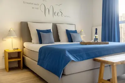 Ein Bett oder Betten in einem Zimmer der Unterkunft Suite Lycka Zingst