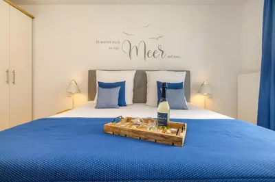 Ein Bett oder Betten in einem Zimmer der Unterkunft Suite Lycka Zingst