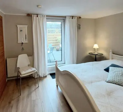 Ein Bett oder Betten in einem Zimmer der Unterkunft Winter's Ferienwohnungen in Prerow