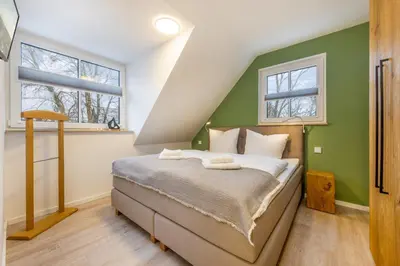 Ein Bett oder Betten in einem Zimmer der Unterkunft Suite Wind & Wellen
