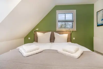 Ein Bett oder Betten in einem Zimmer der Unterkunft Suite Wind & Wellen