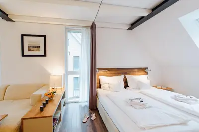 Ein Bett oder Betten in einem Zimmer der Unterkunft M2 Living Maisonette Apartment No 3