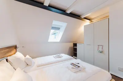 Ein Bett oder Betten in einem Zimmer der Unterkunft M2 Living Maisonette Apartment No 4