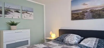 Ein Bett oder Betten in einem Zimmer der Unterkunft Haus Vineta