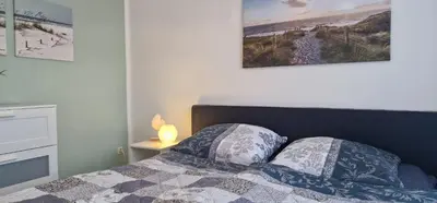 Ein Bett oder Betten in einem Zimmer der Unterkunft Haus Vineta