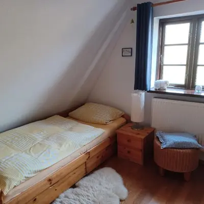 Ein Bett oder Betten in einem Zimmer der Unterkunft FW Im grünen Weg