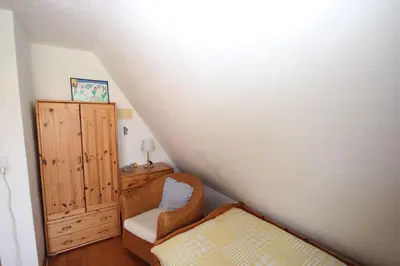 Ein Bett oder Betten in einem Zimmer der Unterkunft FW Im grünen Weg