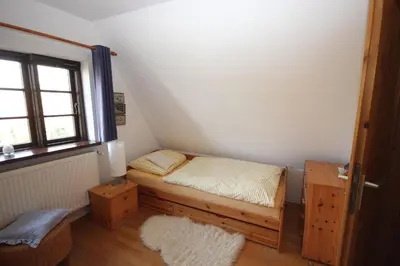 Ein Bett oder Betten in einem Zimmer der Unterkunft FW Im grünen Weg