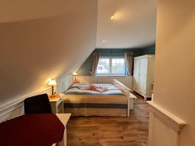 Ein Bett oder Betten in einem Zimmer der Unterkunft Ferienhaus Brise - Matrosenstube