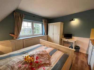 Ein Bett oder Betten in einem Zimmer der Unterkunft Ferienhaus Brise - Matrosenstube