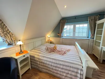 Ein Bett oder Betten in einem Zimmer der Unterkunft Ferienhaus Brise - Kapitänskajüte