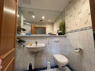 Ein Badezimmer in der Unterkunft Ferienhaus Brise - Kapitänskajüte