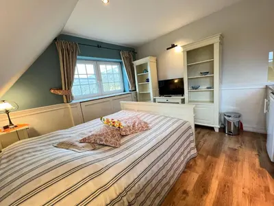 Ein Bett oder Betten in einem Zimmer der Unterkunft Ferienhaus Brise - Kapitänskajüte